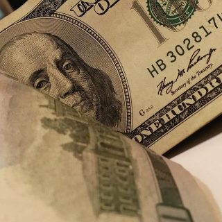 face of Benjamin Franklin on the 100 dollar bill