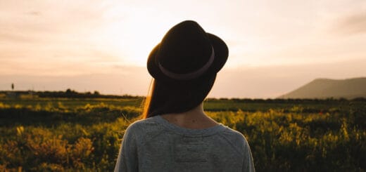 woman with her back to the camera, looking at the horizon