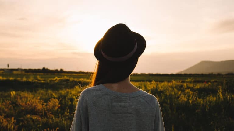 woman with her back to the camera, looking at the horizon